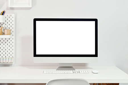 Mockup blank screen desktop computer on stylish workplace