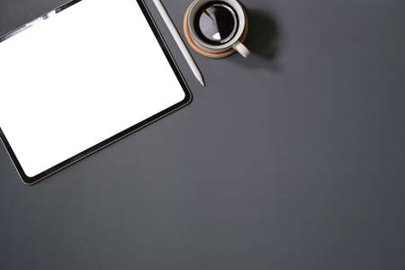 Top view digital display graphics tablet on dark workspace desk tableの写真素材