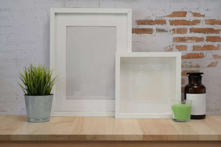 Mock up poster frame on wood table