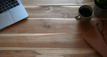 Top view shot of office desktop with laptop and copy spaceの写真素材