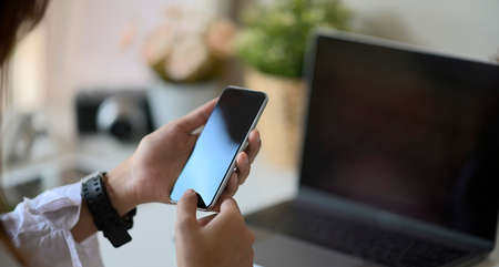 Woman hands with smartphoneの写真素材