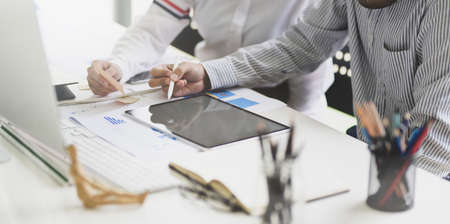 Young professional business people working and discussing the ideas in modern officeの写真素材