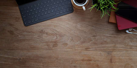 Top view of laptop computer with office accessories on wooden table with copy spaceの写真素材