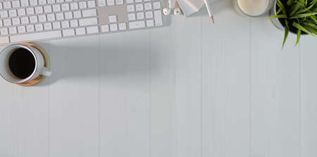 Top view of freelancer's minimal work station with office suppliesの写真素材