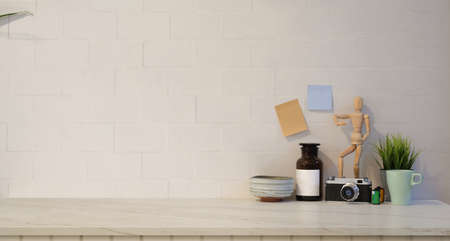 Minimal stylish workplace with white brick wall backgroundの写真素材
