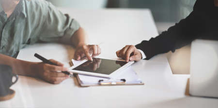 Young professional business people brainstorming the investment strategyの写真素材