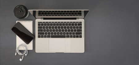 Top view desk with mock up  laptop, mobile smart phone, note and copy spaceの写真素材