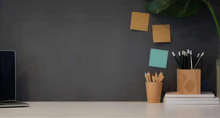 Modern workplace with office supplies, stationary and copy space on white tableの写真素材