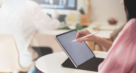 A group of young female freelancers working on their upcoming project in office room with relaxing atmosphereの写真素材