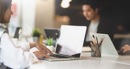 Young attractive businesswoman collecting new idea from the internet for new project