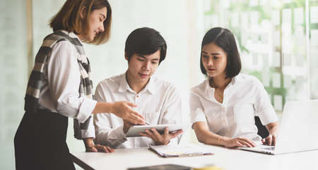 Young startup team brainstorming the marketing strategy for next startup projectの写真素材