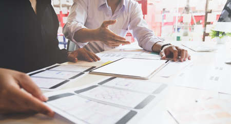 Professional UI UX designer team planing the smartphone template concepts togetherの写真素材