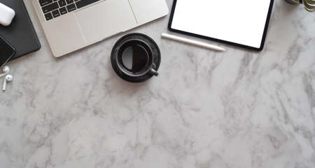 Professional photographer's creative workplace with blank screen laptop, top view with marble desk backgroundの写真素材