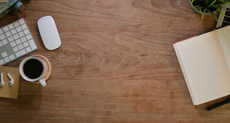 Overhead short of designer workplace with stationary and a cup of coffee