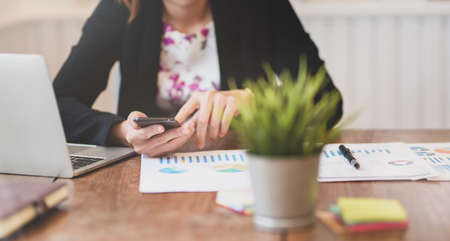 Businesswoman searching new information to improve her projectの写真素材