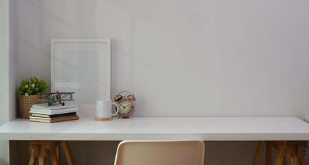 Minimal comfortable workplace with office supplies and copy spaceの写真素材