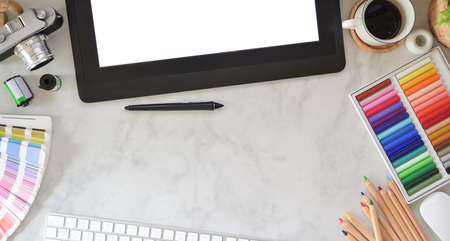 Designer workplace with office supplies, colour swatches and stationery on marble desk backgroundの写真素材