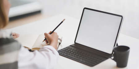 Young professional businesswoman planing her project during the meetingの写真素材