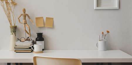 Minimal designer's workplace with copy space and office suppliesの写真素材