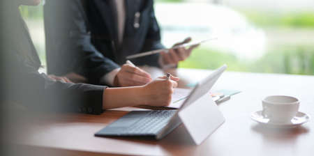 Cropped view of professional businesspeople brainstorming the ideas in office roomの写真素材