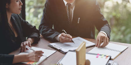Close-up view of professional business people discussing the project together