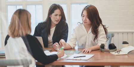 Professional startup team discussing the plan about the upcoming project together in modern office roomの写真素材