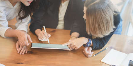 Professional startup team brainstorming the plan together with positive attitude in modern office roomの写真素材