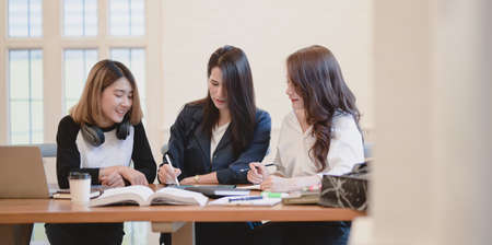 Professional startup team brainstorming the plan together with positive attitude in modern office roomの写真素材