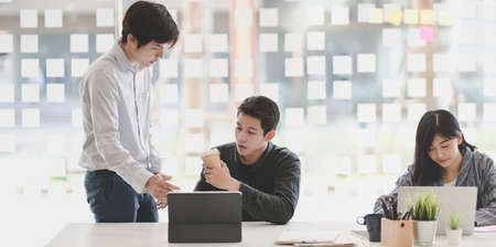 Group of young professional business people brainstorming their project together in the meeting roomの写真素材