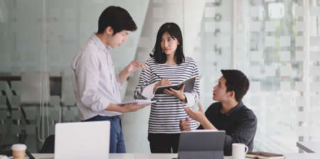 Group of young professional startup team discussing their new project together.の写真素材
