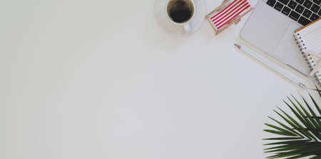 Overhead shot of summer beach workplace with copy space and office accessories and decorationsの写真素材