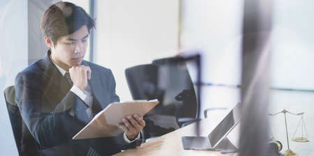 Young professional legal advisor provide legal advice to minimise the risk of organisationの写真素材