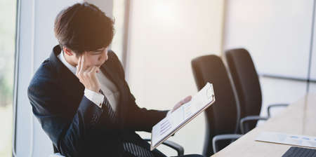Professional accountant planning his financial reports with charts and graphsの写真素材