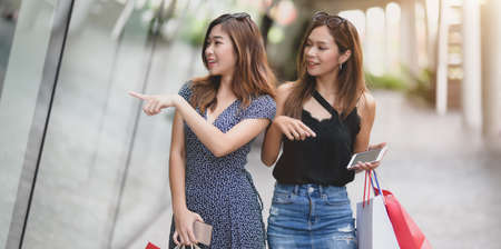 Young beautiful asian women enjoying their life by spending their time shopping at the luxury mallの写真素材