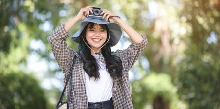 Portrait of young asian traveler visiting the ancient historical places during the vacationの写真素材