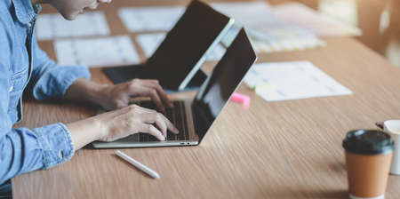 Close-up view of passionate UX web designer team planing interface project together with smartphone templatesの写真素材