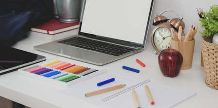 Back to school concept : Blank screen tablet with stationary and decorations on modern workplace, close-up viewの写真素材