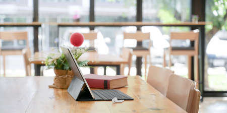 Comfortable co-working space with digital tablet with keyboard and decorations の写真素材