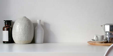 Minimal room with ceramic vases decoration with coffee cup with copy space の写真素材
