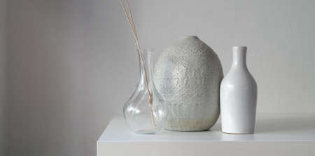 Minimal room with ceramic vases decoration on white table with copy space の写真素材