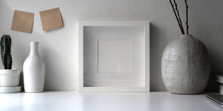 Photo frame mock up with ceramic vase, Scandinavian styleの写真素材