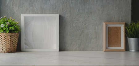 Modern office room with mock up frame and decorations with copy space on marble desk backgroundの写真素材