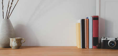 Close-up view of comfortable workspace with copy space and office supplies on wooden tableの写真素材