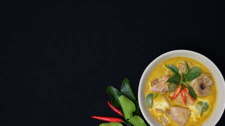 Top view of Thai chicken green curry on black desk background with copy spaceの写真素材