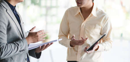 Cropped shot of young business team exchanging the concept of their project in modern office room 