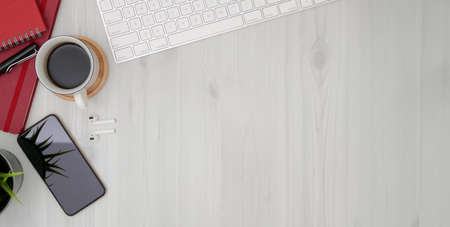 Top view of trendy workplace with office supplies and copy space on wooden table