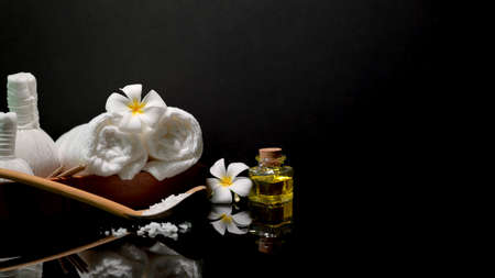 Dark stylist spa composition with spa product on black table and dark background with copy space の写真素材