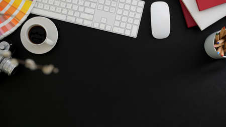 Top view of modern designer workplace with blank screen tablet, office supplies and copy space