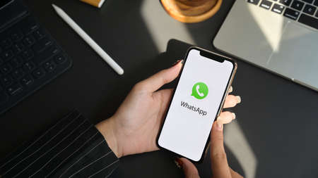 CHIANG MAI, THAILAND - JANUARY 31, 2020 : female holding iPhone with WhatsApp screen. WhatsApp is multi-function messaging applicationのeditorial素材