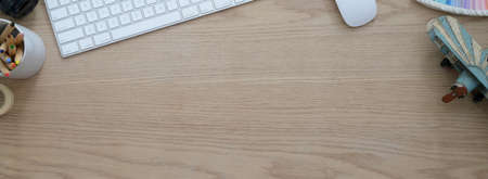 Top view of comfortable workspace with computer devices,  supplies, decoration and copy space on...